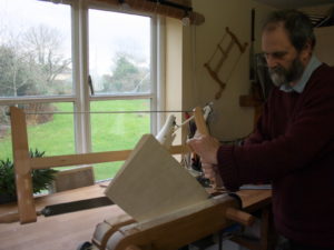 violin maker William Castle sawing a violin back