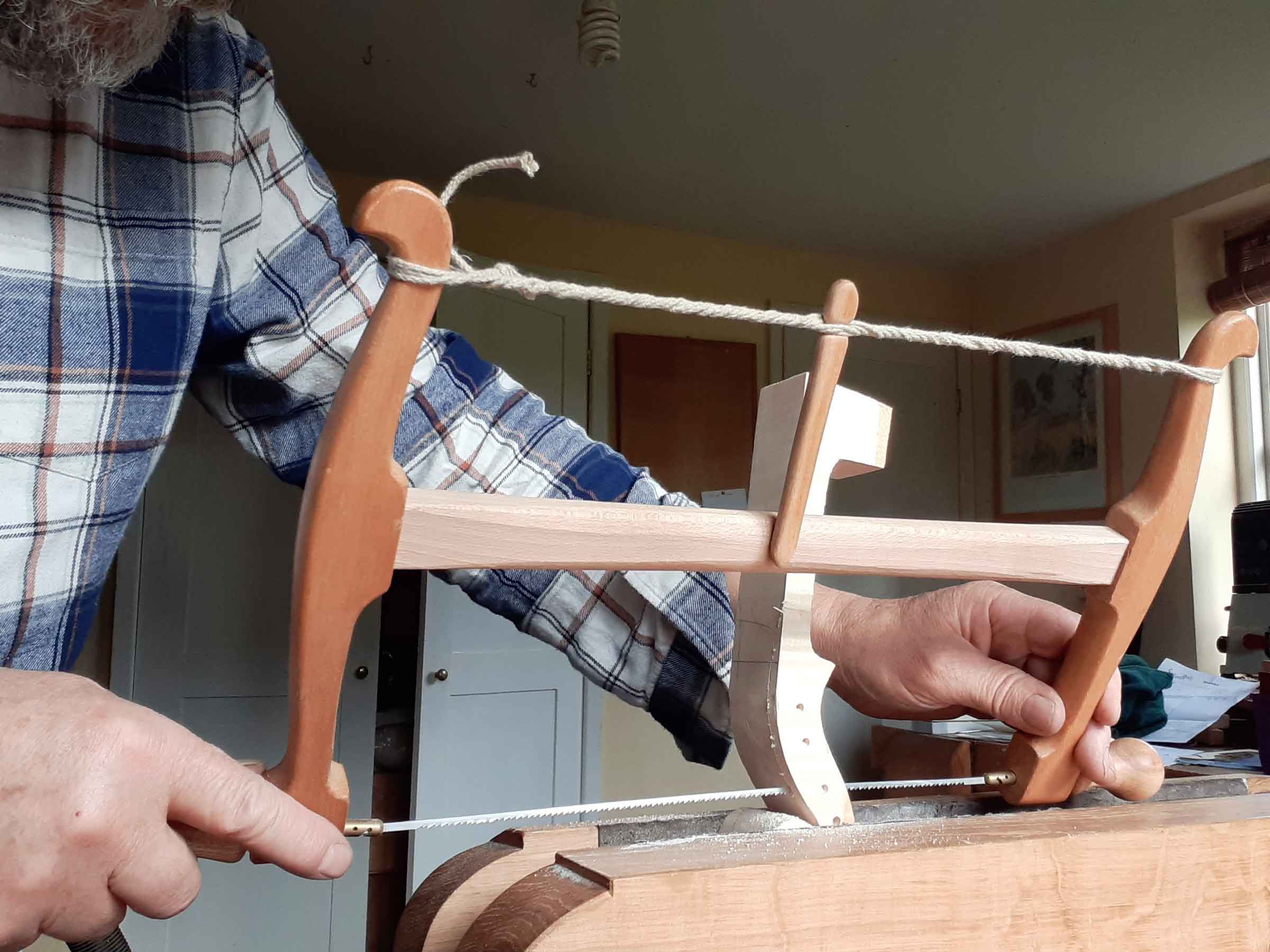 sawing out violin scroll
